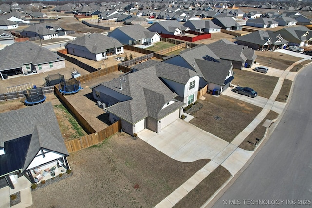 birds eye view of property with a residential view