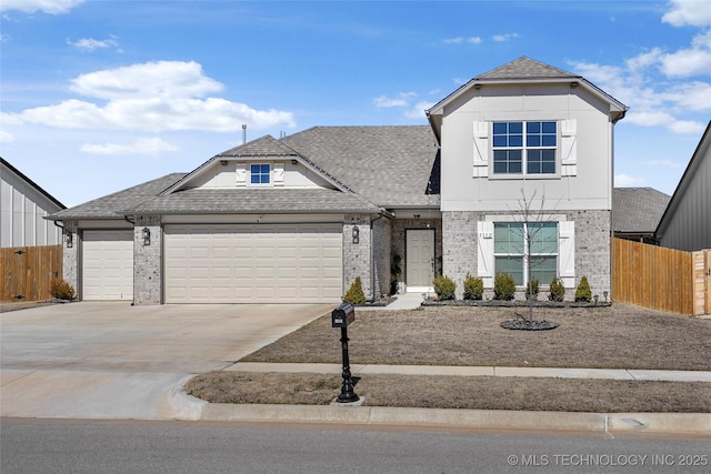 view of front of home featuring a garage, driveway, brick siding, and fence