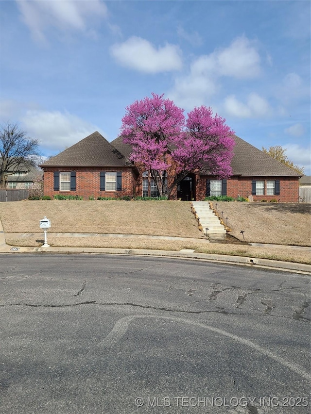 view of front of home featuring brick siding