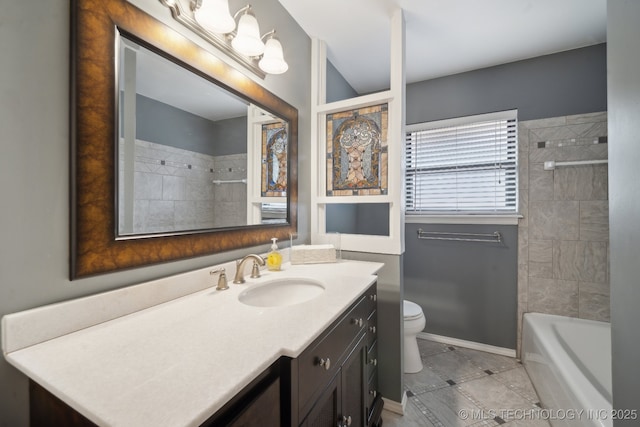 full bath featuring shower / tub combination, toilet, vanity, baseboards, and tile patterned floors