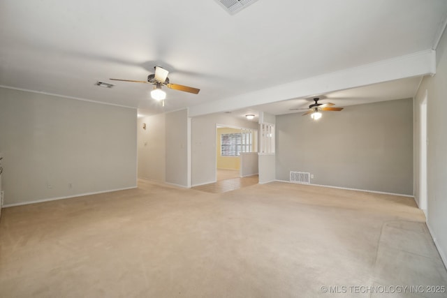 spare room featuring visible vents, a ceiling fan, and light colored carpet