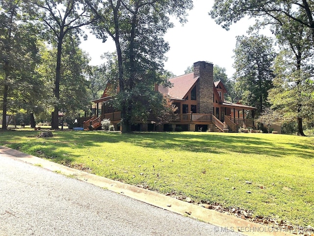 view of property exterior with a yard and a chimney