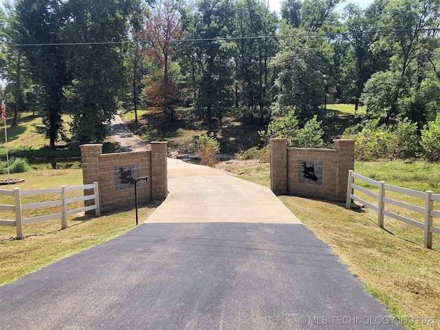 view of gate with fence