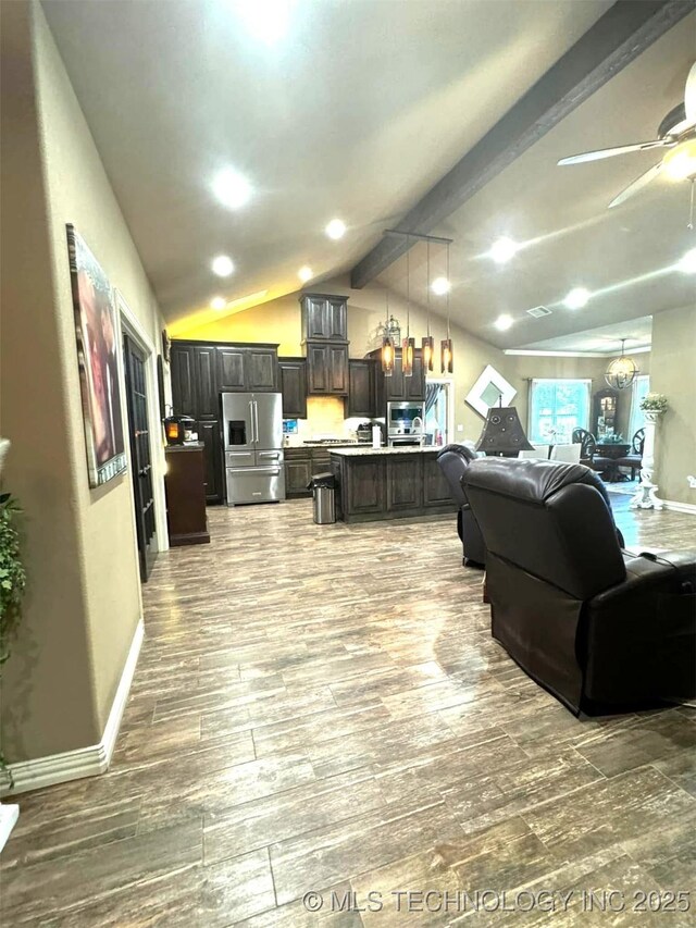 17 Tabernacle Dr, Calera, OK 74730 - living room featuring baseboards, wood finished floors, lofted ceiling with beams, and ceiling fan