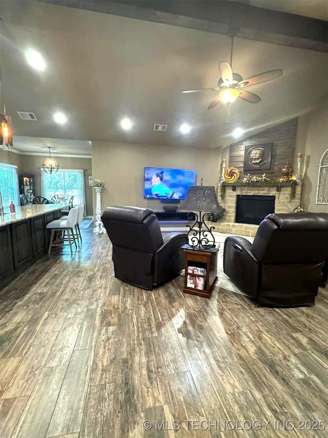17 Tabernacle Dr, Calera, OK 74730 - living area with a ceiling fan, visible vents, a fireplace, and wood-type flooring