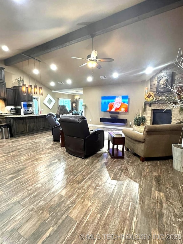 17 Tabernacle Dr, Calera, OK 74730 - living area with wood finished floors, a fireplace, vaulted ceiling with beams, ceiling fan, and recessed lighting