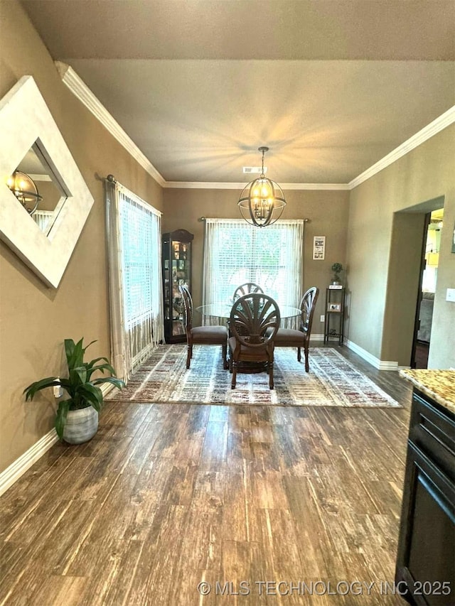 17 Tabernacle Dr, Calera, OK 74730 - dining area with crown molding, a notable chandelier, baseboards, and wood finished floors