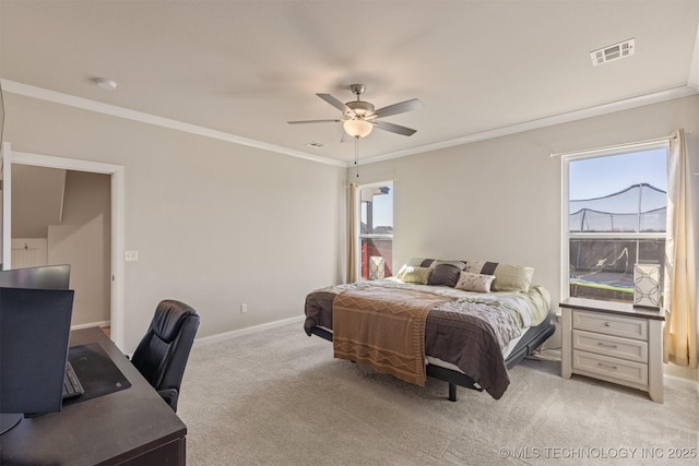 bedroom featuring light carpet, multiple windows, visible vents, and crown molding