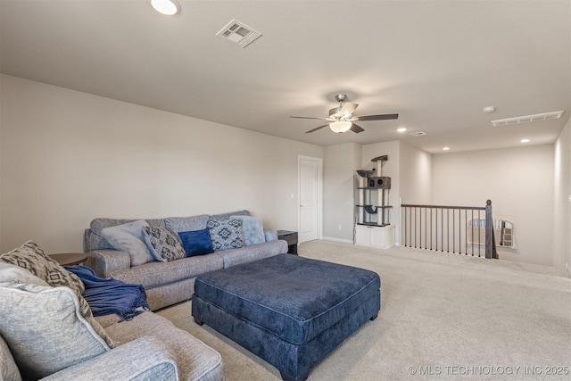 living area with light colored carpet, visible vents, ceiling fan, and recessed lighting