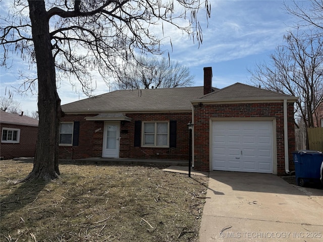 single story home featuring a garage, brick siding, driveway, and a chimney