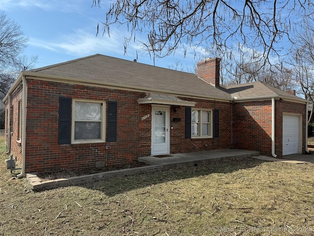 view of front of home featuring brick siding, a chimney, an attached garage, and roof with shingles