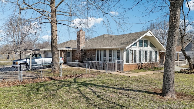 view of front facade with a sunroom, a chimney, fence, and brick siding