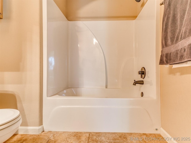 full bathroom with baseboards, shower / washtub combination, toilet, and tile patterned floors