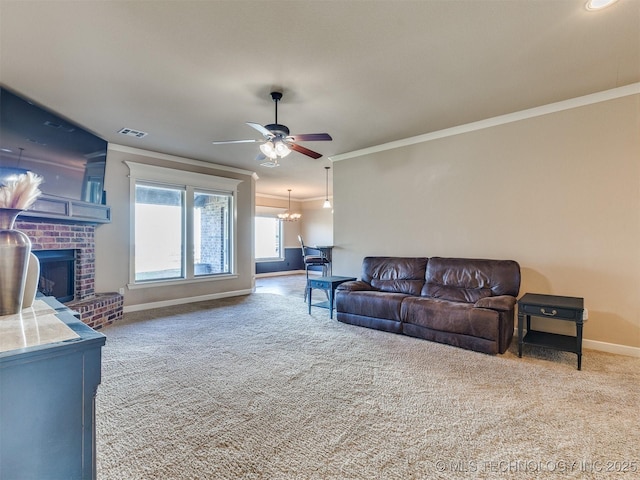 carpeted living room featuring crown molding, visible vents, a ceiling fan, a brick fireplace, and baseboards