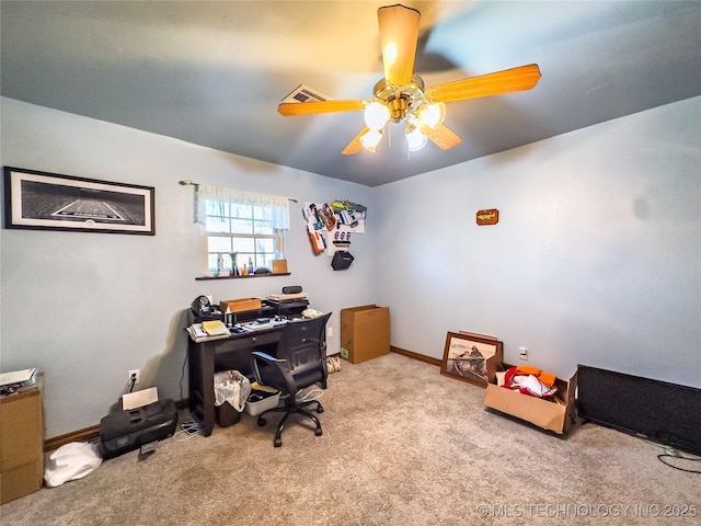 office space featuring carpet floors, visible vents, baseboards, and a ceiling fan