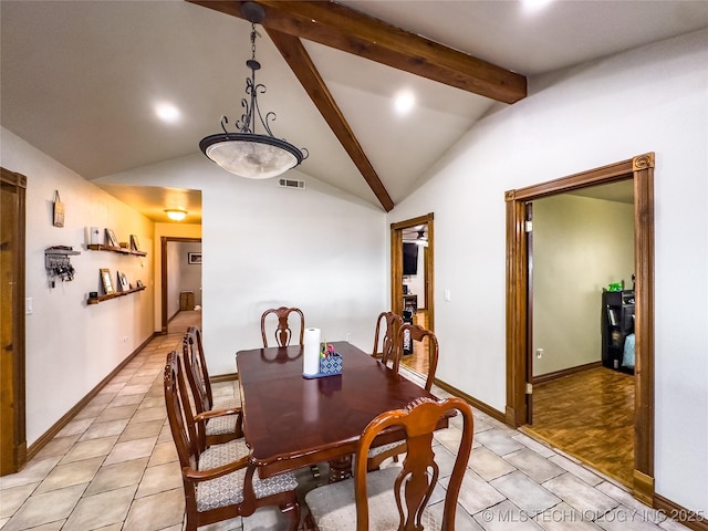 dining space with lofted ceiling with beams, light tile patterned floors, visible vents, and baseboards