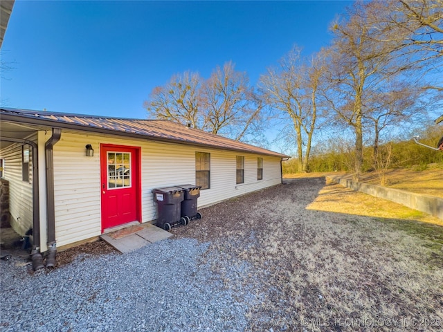 view of home's exterior featuring metal roof