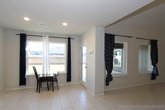 dining area featuring baseboards, visible vents, and recessed lighting