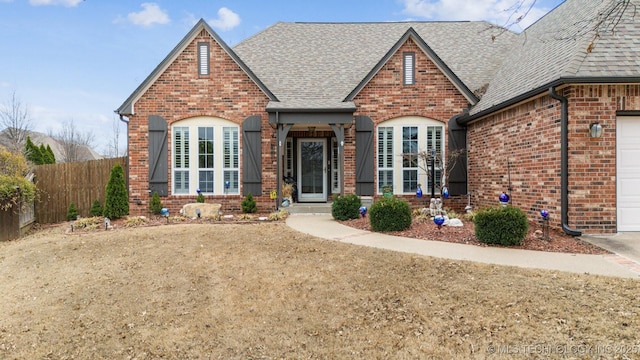 3203 Callaway Dr, Claremore, OK 74019 - view of front of home with brick siding, roof with shingles, and an attached garage