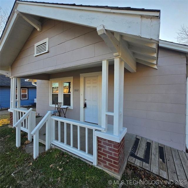 entrance to property with a porch