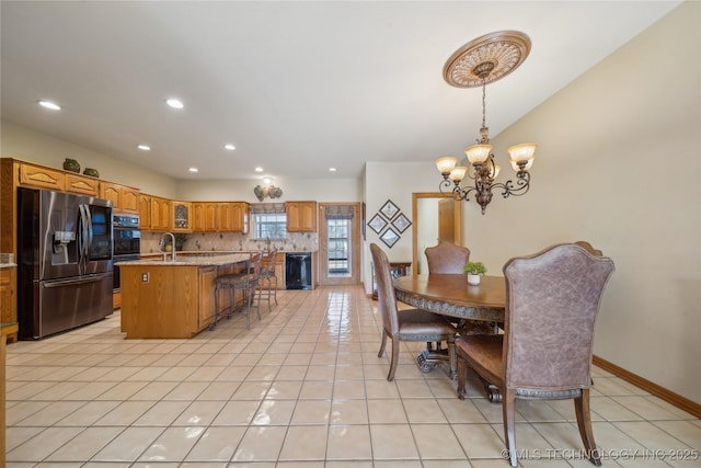63320 E 293rd Rd, Grove, OK 74344 - dining area with light tile patterned floors, recessed lighting, a notable chandelier, and baseboards