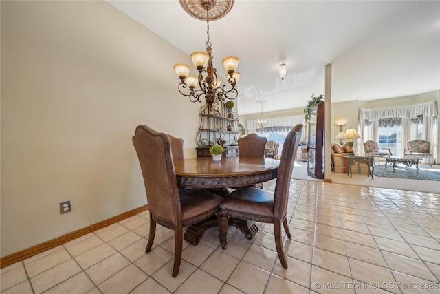 63320 E 293rd Rd, Grove, OK 74344 - dining space with light tile patterned floors, a wealth of natural light, a chandelier, and baseboards