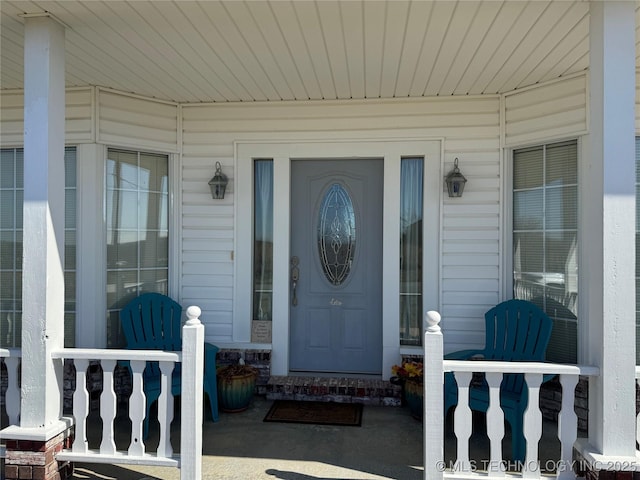 doorway to property featuring covered porch