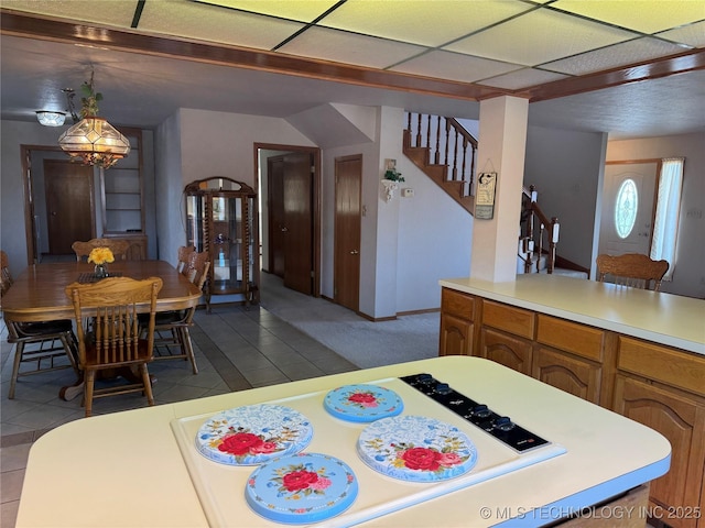 dining room featuring stairway and tile patterned floors