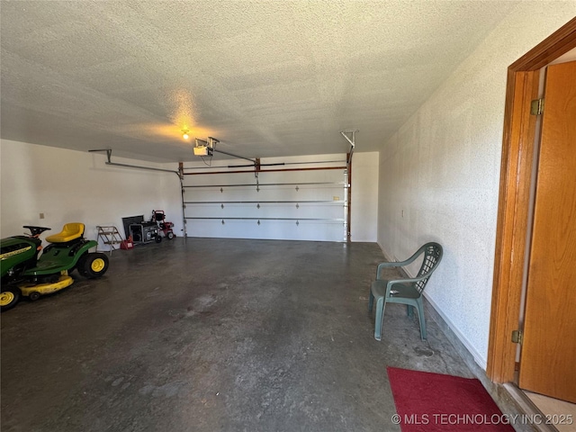 garage featuring a garage door opener and a textured wall