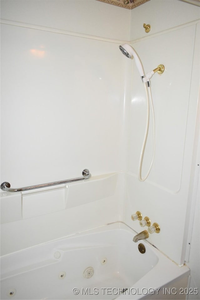 bathroom with a combined bath / shower with jetted tub