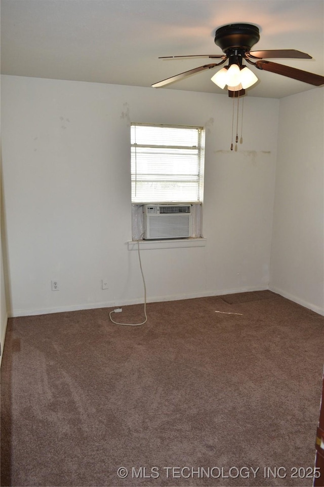 carpeted spare room featuring cooling unit, ceiling fan, and baseboards