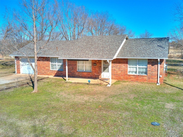 single story home with a garage, brick siding, a front lawn, and a shingled roof