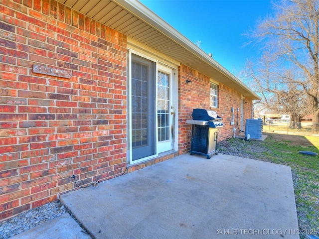 view of patio / terrace featuring grilling area and central AC unit