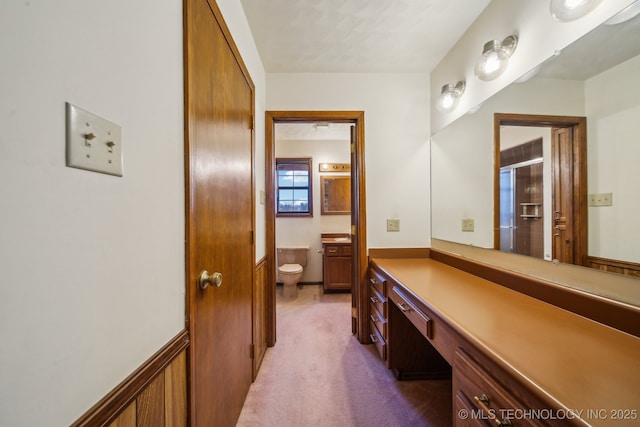 full bath featuring wainscoting, vanity, and toilet