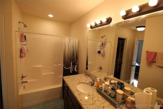 bathroom featuring shower / bath combination and vanity