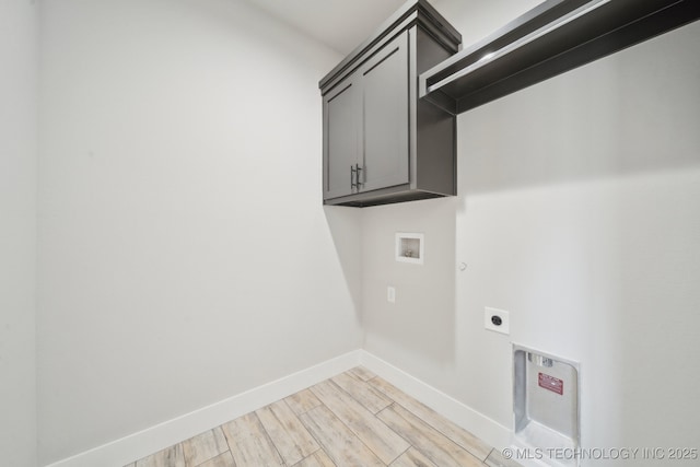 laundry area with washer hookup, cabinet space, light wood-style floors, electric dryer hookup, and baseboards