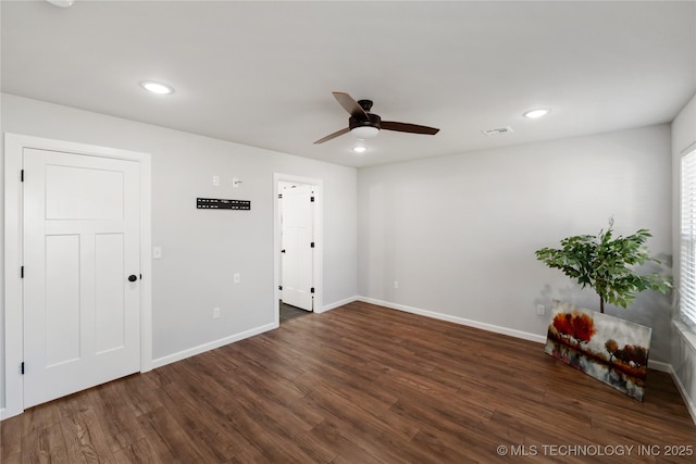 empty room featuring visible vents, baseboards, wood finished floors, and recessed lighting