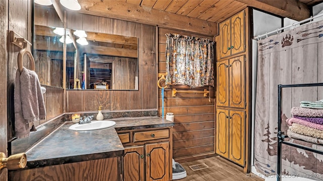 full bathroom featuring wood ceiling, wood walls, vanity, and wood finished floors