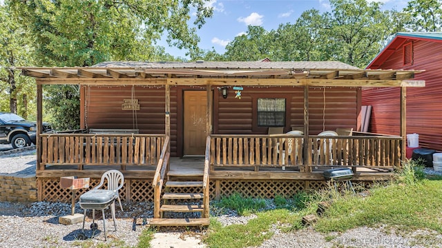 back of property featuring faux log siding