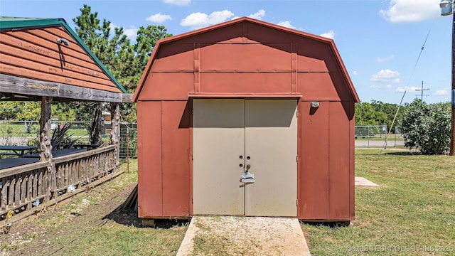 view of shed with fence