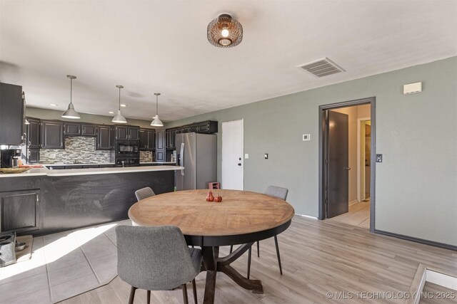 dining space featuring recessed lighting, baseboards, visible vents, and light wood finished floors