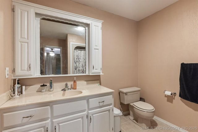 bathroom with tile patterned flooring, vanity, toilet, baseboards, and a shower with curtain