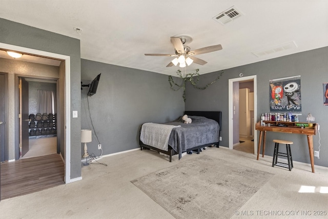 bedroom with visible vents, carpet flooring, baseboards, and ceiling fan