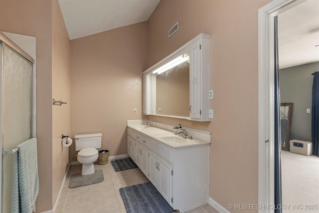 bathroom with toilet, baseboards, visible vents, and a sink