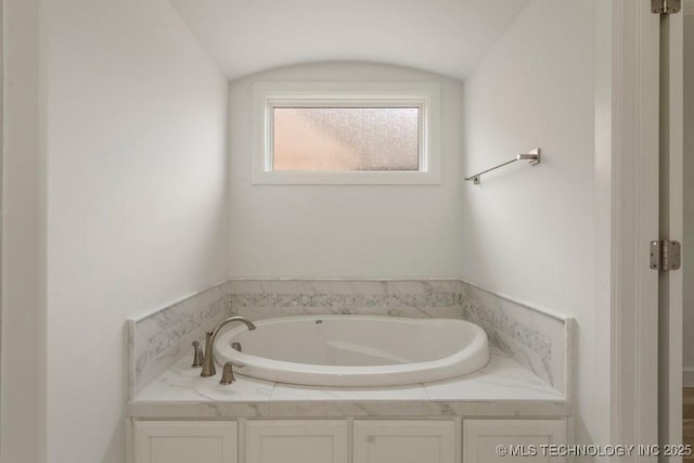 bathroom featuring a garden tub