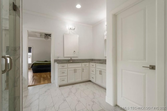 full bathroom featuring ensuite bathroom, vanity, marble finish floor, ornamental molding, and a shower stall