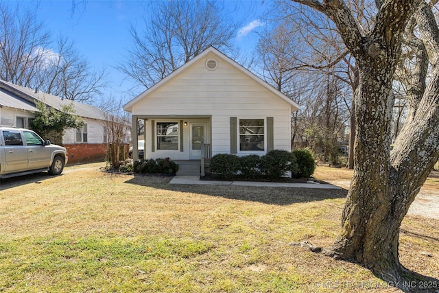 view of front of property with a porch and a front yard