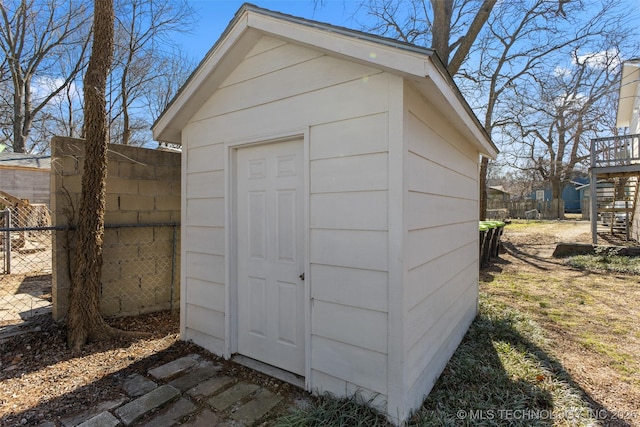 view of shed with fence