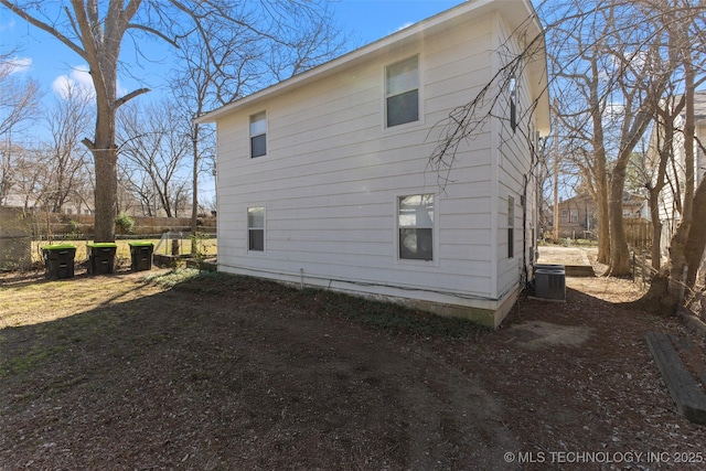 view of side of property with fence