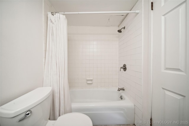 bathroom featuring shower / bath combo and toilet